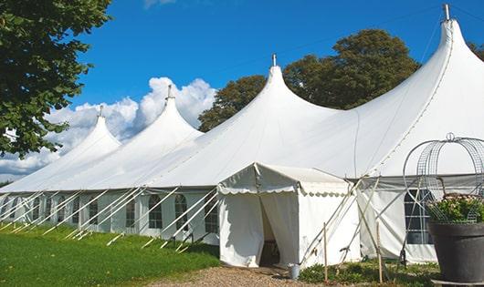 a line of sleek and modern portable restrooms ready for use at an upscale corporate event in Collinsville